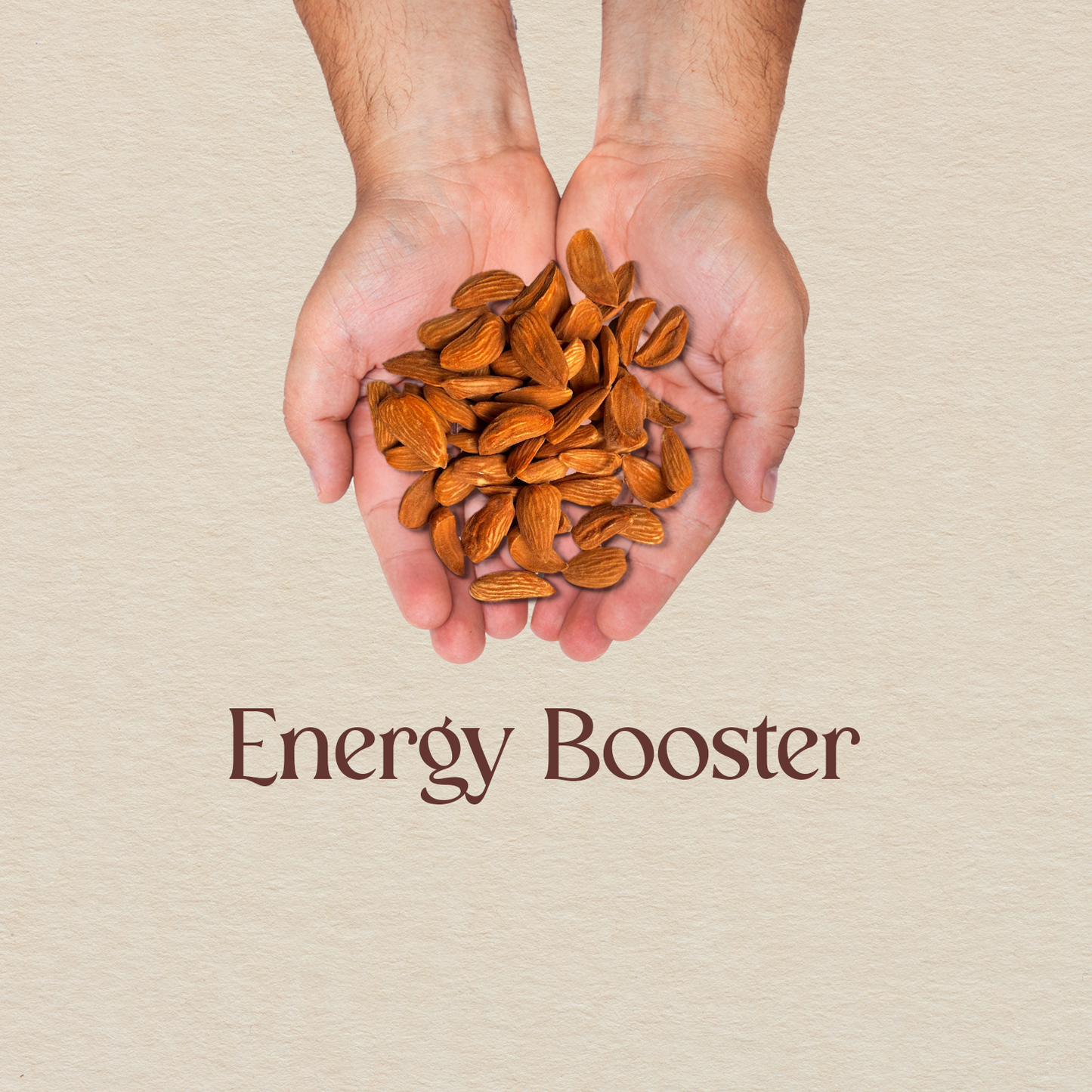 Hands holding a pile of golden-brown almond kernels