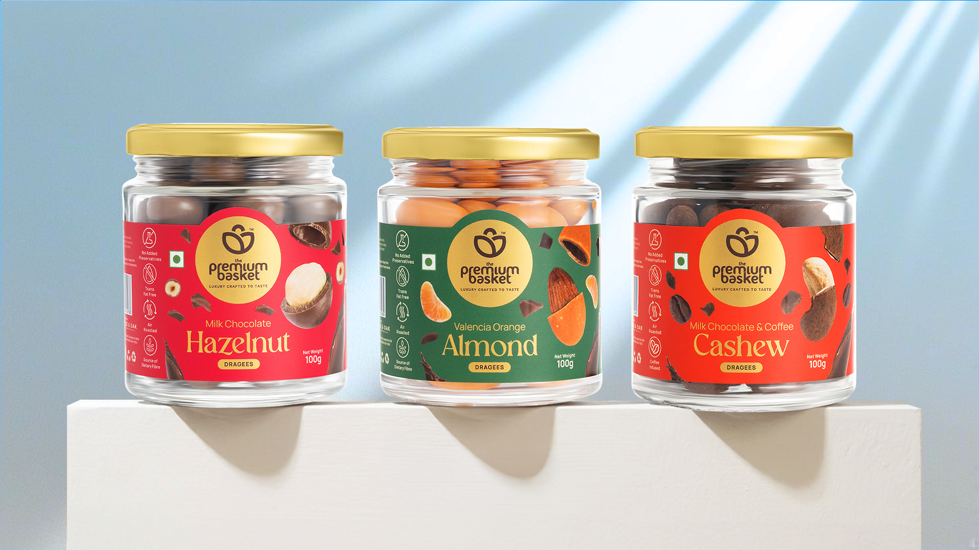 Assorted dragee jars: Hazelnut, Valencia Orange Almond and Cashew in milk chocolate